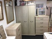 wooden wardrobes, and draws in a light oak