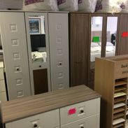 wooden draws and wardrobes with mirrors