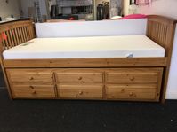 wooden bed with draws underneath
